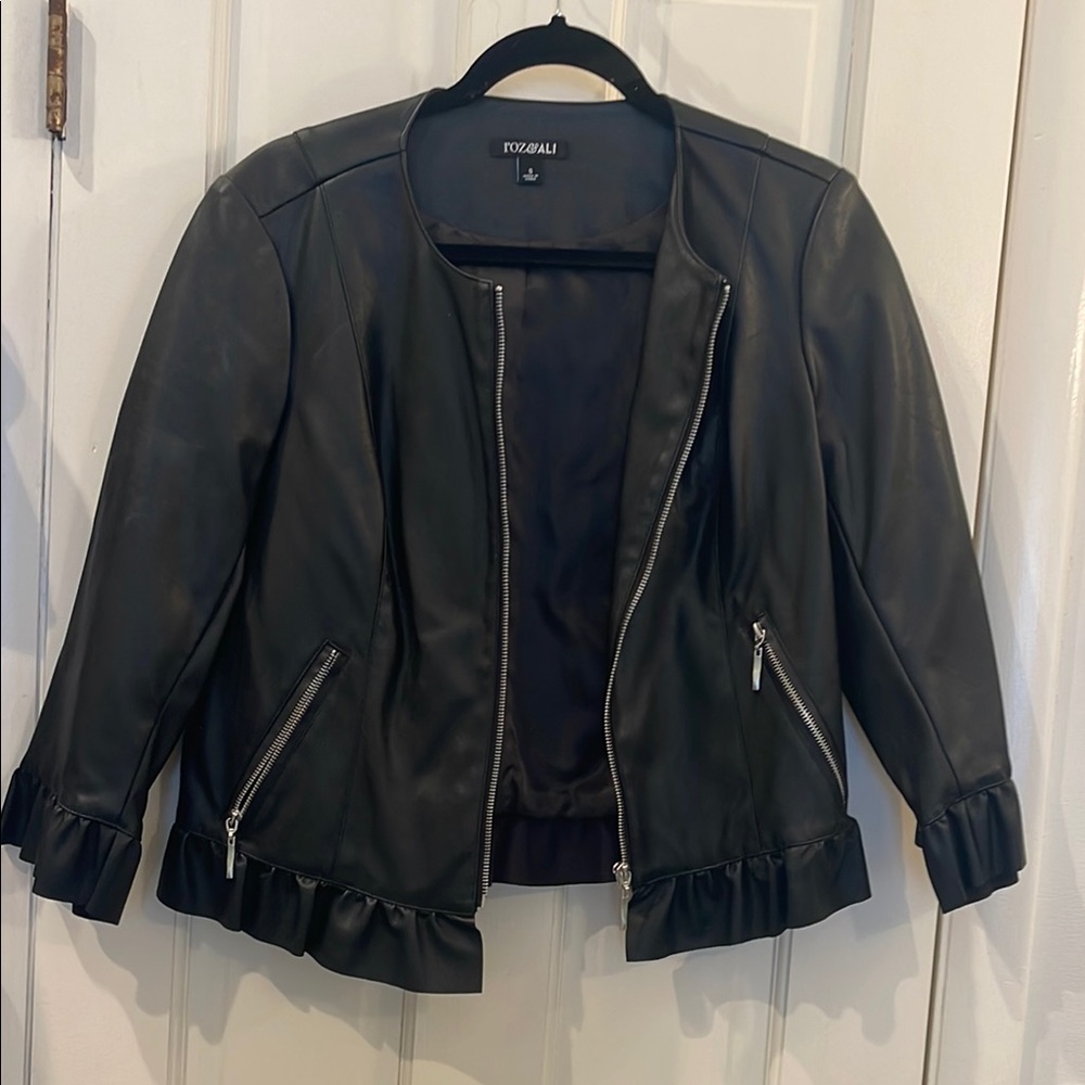 Pleather S zip up jacket with fringe bottom and arms as show.